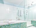 Contemporary Home Bathroom with Shower Stall, Tub and Glass Tiles