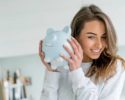 happy-woman-saving-money-in-piggybank