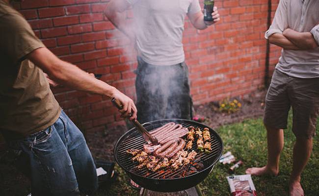 men-drinking-beer-and-hanging-out-at-an-african-braai