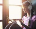 teenager-girl-using-tablet-headphone