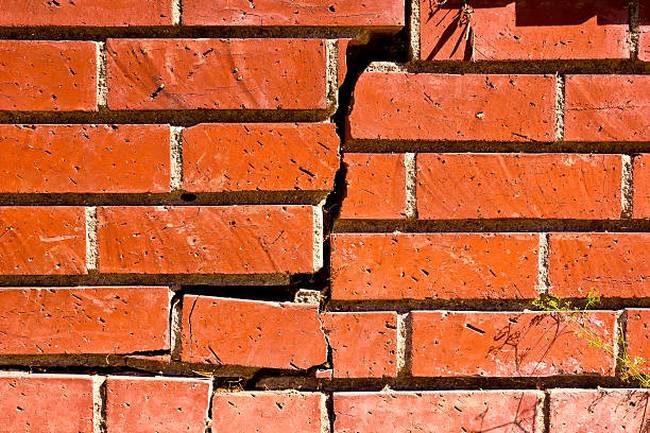 close-up-broken-brick-wall