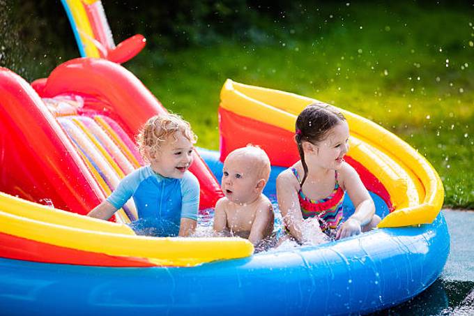 children-playing-in-inflatable-swimming-pool