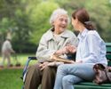 senior-woman-with-caregiver-in-the-park